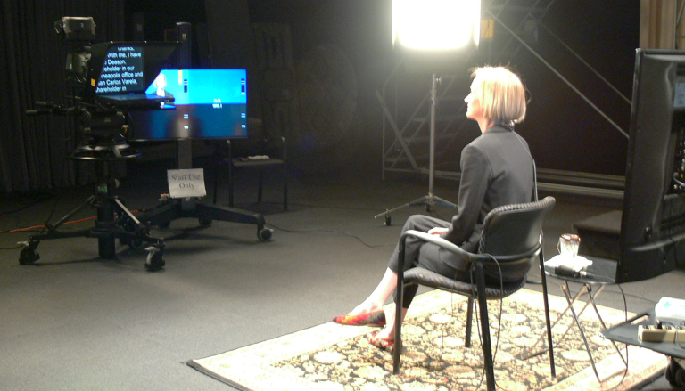 BP-01 Talent preparing for scripted delivery in lit studio