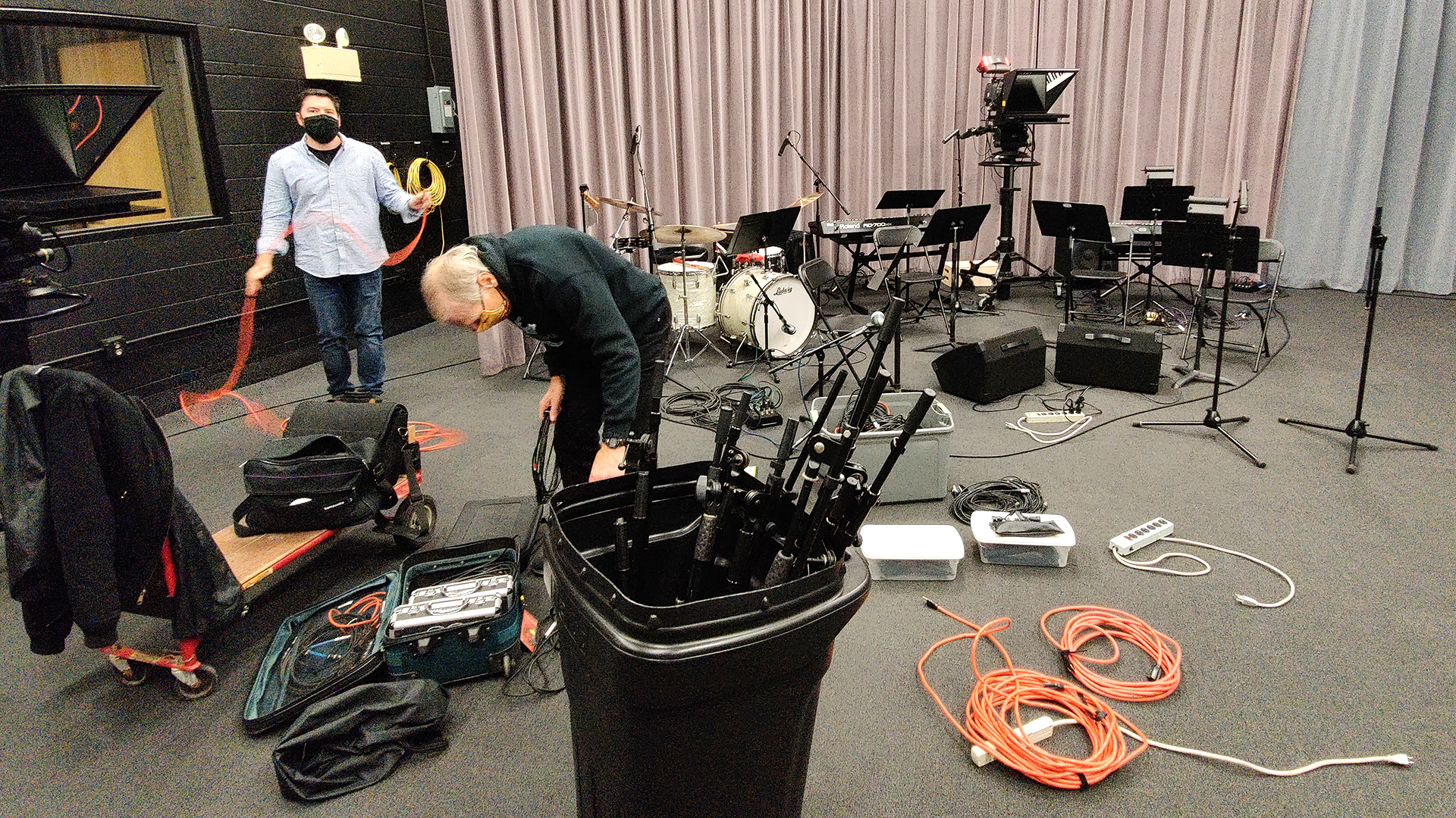 Setting up microphones for pit musicians